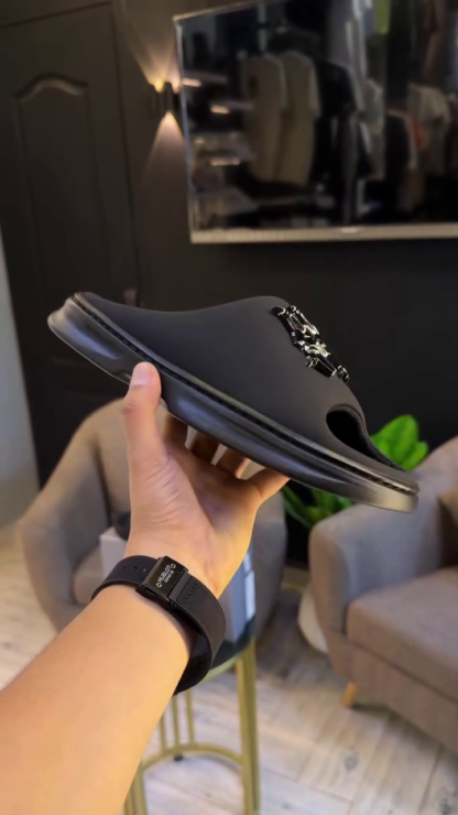 Black slip-on slides sole view